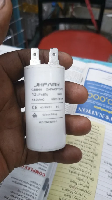New motor run capacitor held before fitting