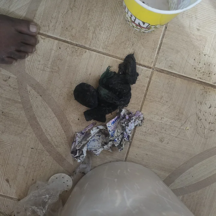 Socks and debris pulled out from inside a washing machine